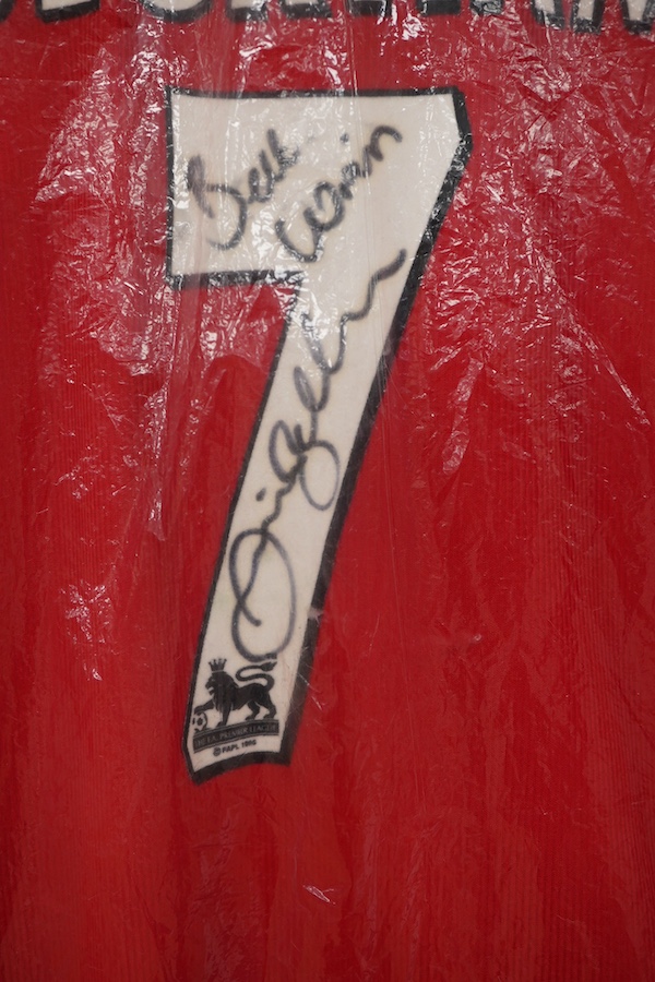 A Manchester United Umbro Sharp polo shirt, signed by David Beckham